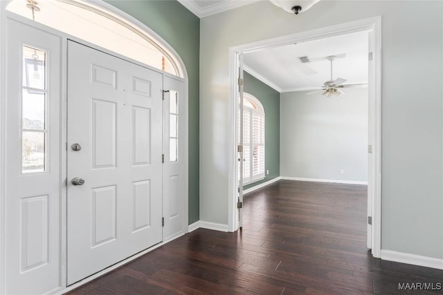 foyer entrance with wood finished floors, visible vents, baseboards, a ceiling fan, and crown molding