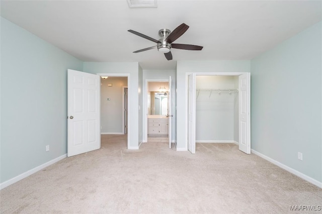 unfurnished bedroom with carpet floors, a closet, visible vents, and baseboards