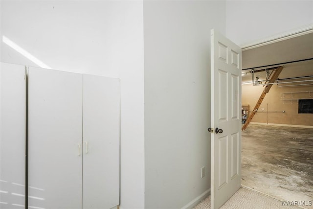 bathroom featuring unfinished concrete flooring and baseboards