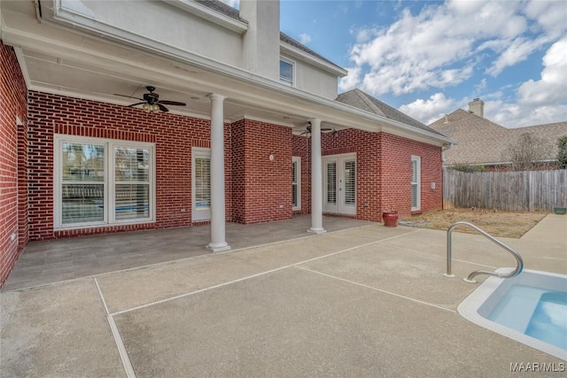 view of patio featuring fence, a ceiling fan, and french doors