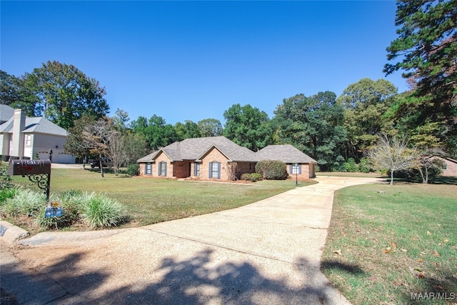 ranch-style house with a front yard