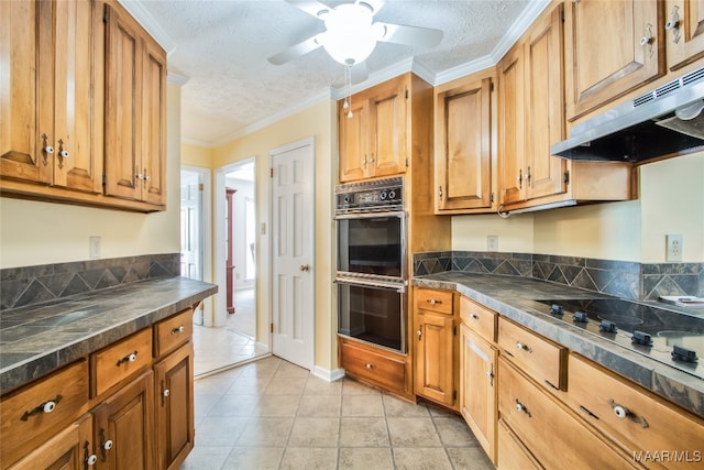 kitchen with crown molding, a textured ceiling, stovetop, and black double oven