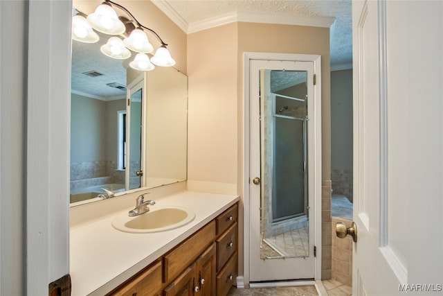 bathroom featuring vanity, a textured ceiling, and an enclosed shower