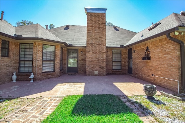 rear view of house featuring a patio