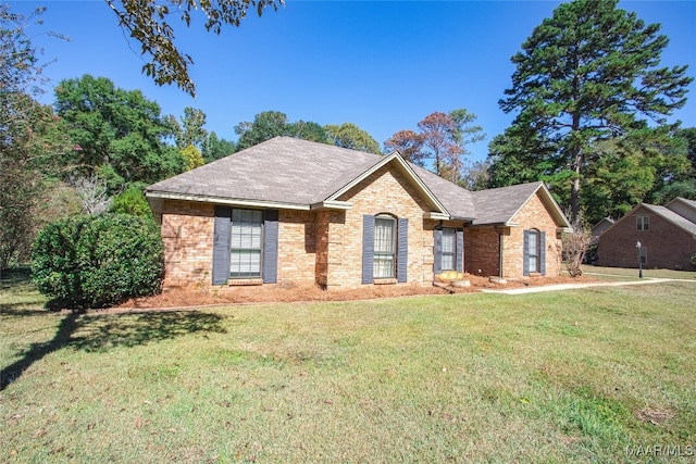 ranch-style home with a front lawn