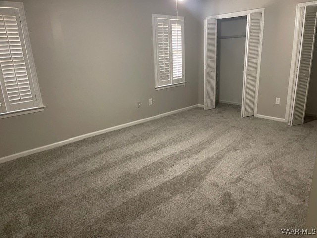 unfurnished bedroom with carpet