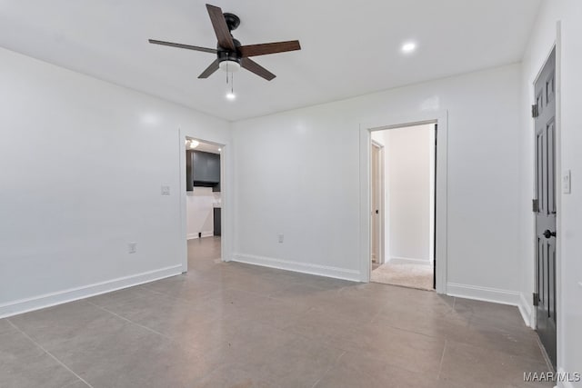 unfurnished room with ceiling fan