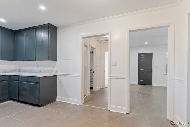 kitchen featuring ornamental molding and light tile patterned floors