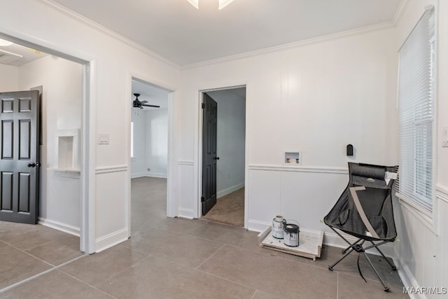 home office featuring crown molding, ceiling fan, and light tile patterned floors