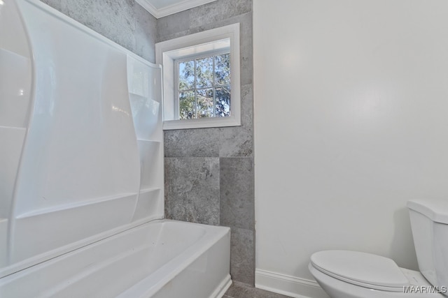 bathroom with a bath, toilet, and ornamental molding