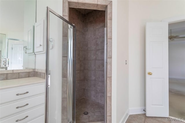 bathroom featuring vanity, tile patterned floors, a shower with door, and ceiling fan