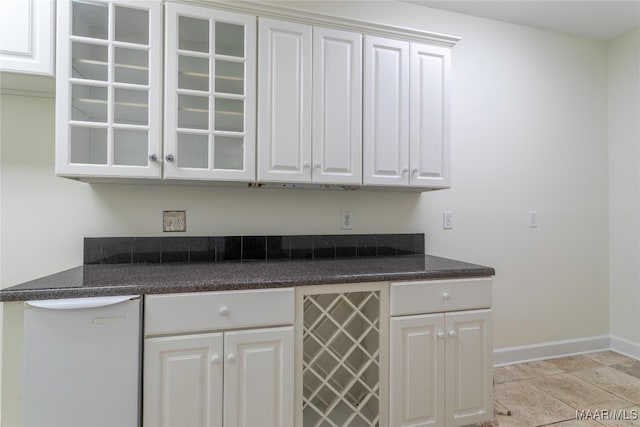 kitchen with wine cooler, light tile patterned flooring, dishwasher, and white cabinets