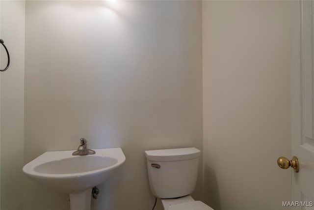 bathroom with sink and toilet