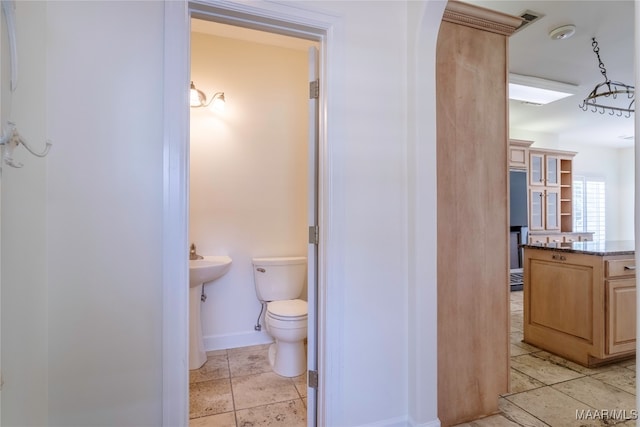 bathroom featuring tile patterned floors and toilet