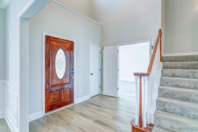 200 Mcrae Rd, Deatsville, AL 36022 - foyer entrance with light wood finished floors, stairway, and baseboards