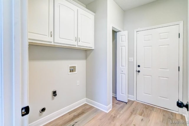 200 Mcrae Rd, Deatsville, AL 36022 - laundry room featuring cabinet space, light wood-type flooring, baseboards, hookup for a washing machine, and hookup for an electric dryer