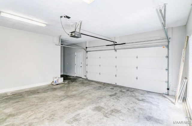 200 Mcrae Rd, Deatsville, AL 36022 - garage featuring a garage door opener