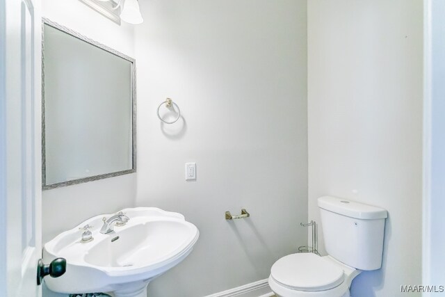 bathroom with toilet and sink