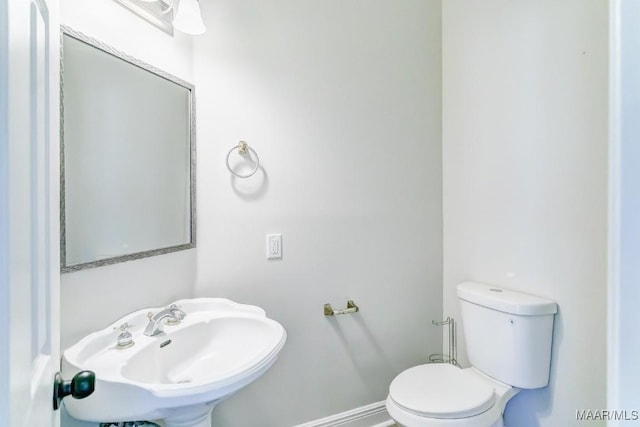 200 Mcrae Rd, Deatsville, AL 36022 - bathroom with toilet, a sink, and baseboards