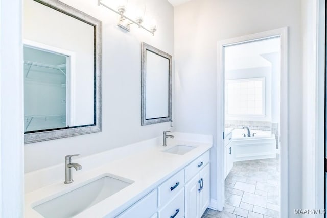 200 Mcrae Rd, Deatsville, AL 36022 - bathroom featuring double vanity and a garden tub