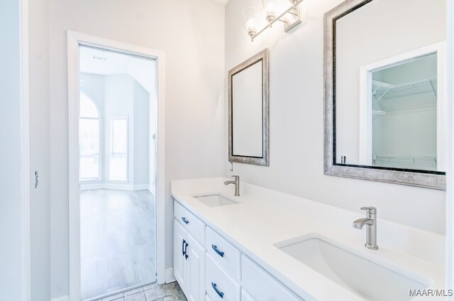 bathroom with vanity and tile patterned flooring