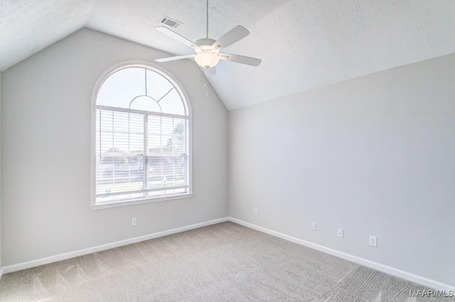 200 Mcrae Rd, Deatsville, AL 36022 - carpeted spare room featuring lofted ceiling, a ceiling fan, baseboards, and a textured ceiling
