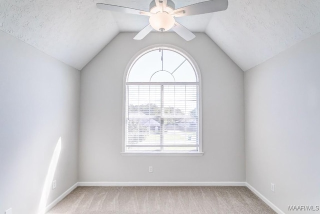 200 Mcrae Rd, Deatsville, AL 36022 - empty room featuring healthy amount of natural light, carpet floors, ceiling fan, lofted ceiling, and a textured ceiling