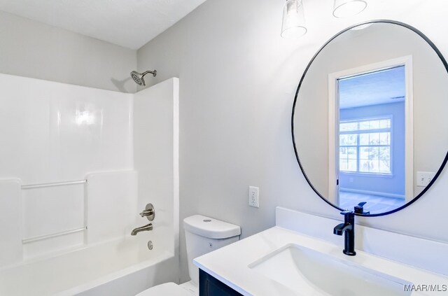 full bathroom featuring vanity, toilet, and shower / tub combination