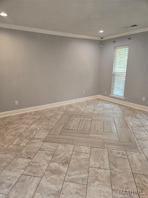 spare room with ornamental molding