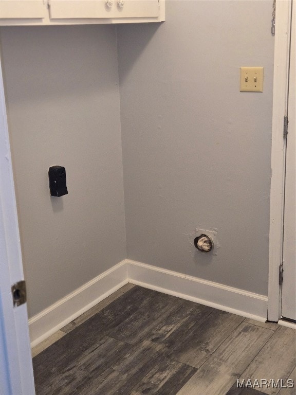 laundry area with dark hardwood / wood-style flooring