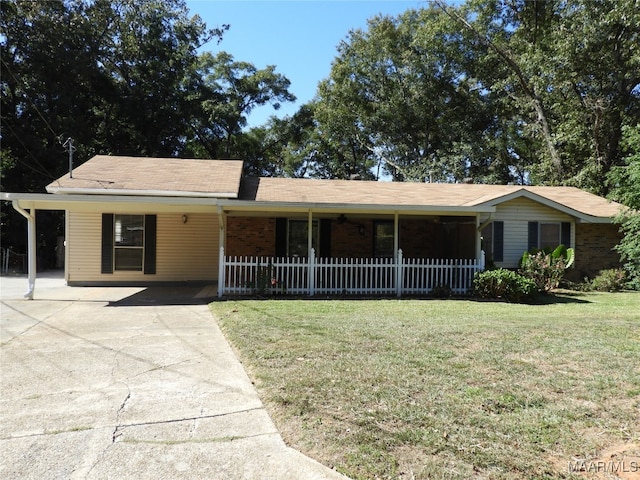 single story home featuring a front yard and a carport