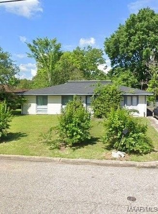 view of property exterior featuring a lawn