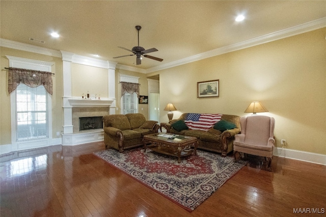 living room with crown molding, hardwood / wood-style floors, and ceiling fan