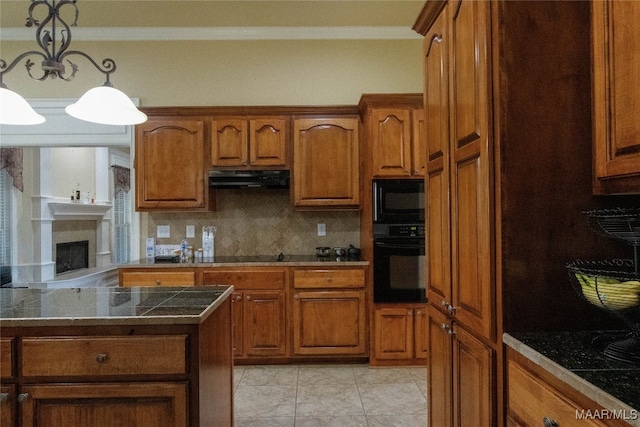 kitchen featuring tasteful backsplash, black appliances, ornamental molding, and pendant lighting