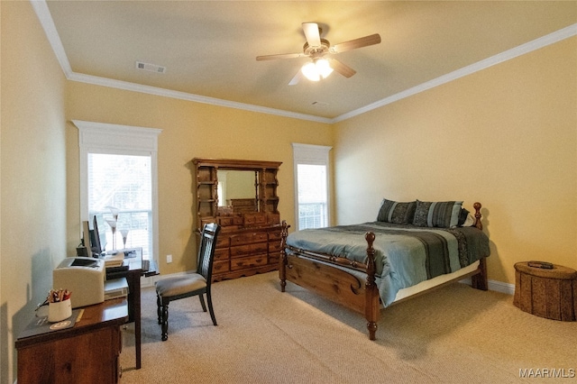 bedroom featuring ceiling fan, ornamental molding, and carpet floors