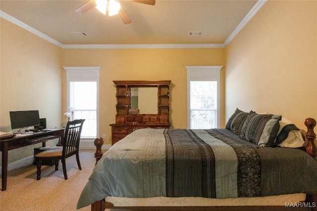 bedroom featuring multiple windows, ornamental molding, carpet flooring, and ceiling fan