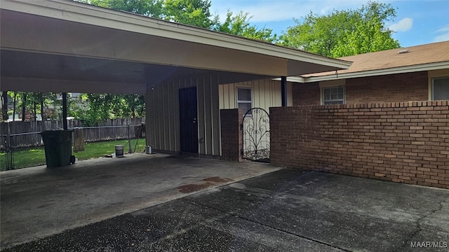 view of exterior entry with a carport