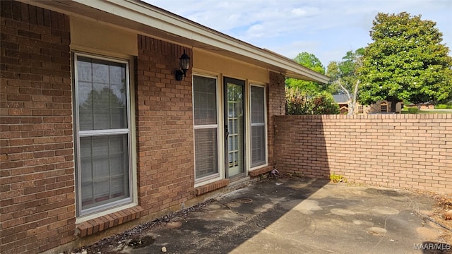 view of side of property with a patio area