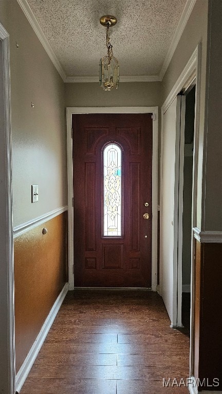 doorway to outside with crown molding, hardwood / wood-style floors, a textured ceiling, and a notable chandelier