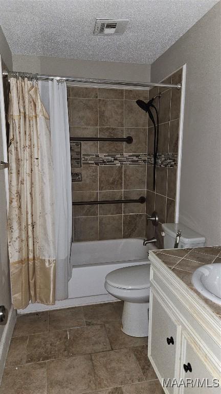 full bathroom with vanity, a textured ceiling, toilet, and shower / bathtub combination with curtain