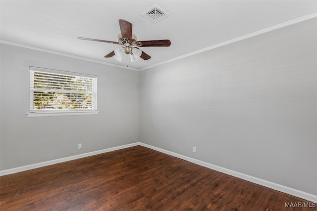 empty room with crown molding, ceiling fan, and dark hardwood / wood-style flooring