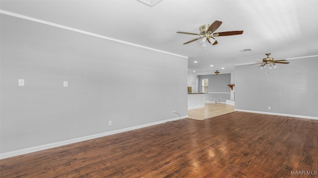 unfurnished living room with hardwood / wood-style floors, crown molding, and ceiling fan