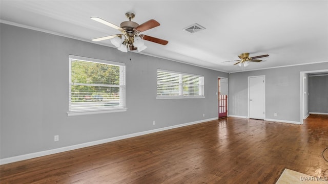 spare room featuring ceiling fan, ornamental molding, and dark hardwood / wood-style floors