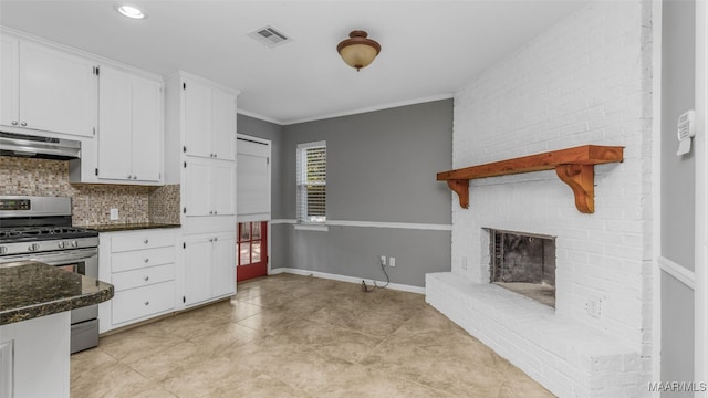 kitchen with tasteful backsplash, white cabinetry, stainless steel range with gas cooktop, crown molding, and ventilation hood