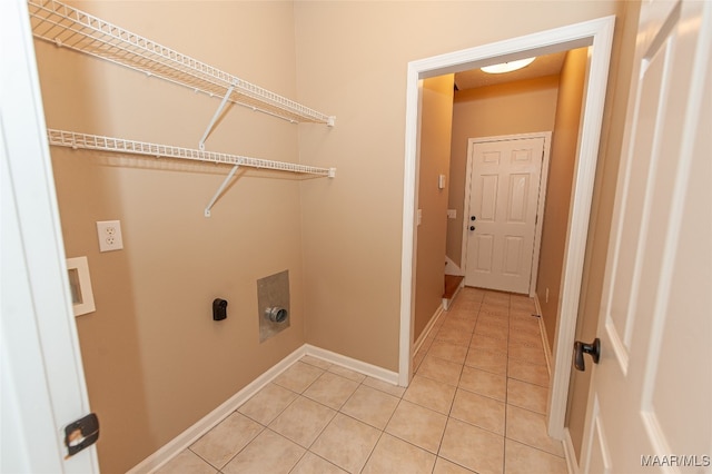 laundry area with tile patterned flooring