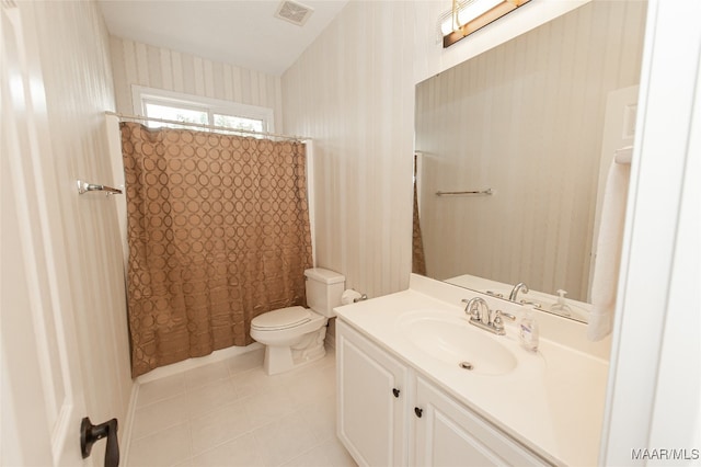 bathroom with vanity, toilet, tile patterned floors, and curtained shower