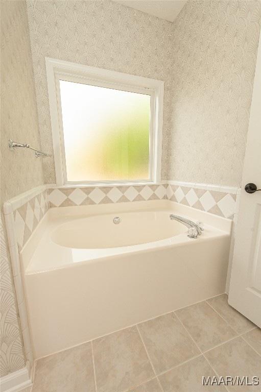 bathroom featuring a bathtub and tile patterned floors