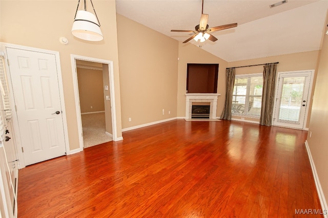 unfurnished living room with hardwood / wood-style floors, vaulted ceiling, and ceiling fan