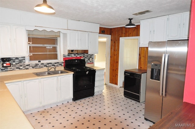 kitchen with backsplash, black appliances, sink, and white cabinets