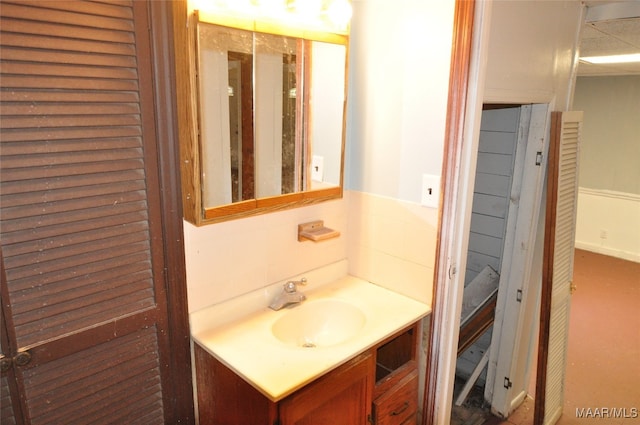 bathroom featuring vanity and decorative backsplash